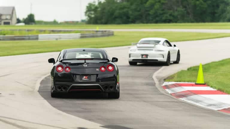 Nissan GT-R and Porsche 911 GT3 on a racetrack