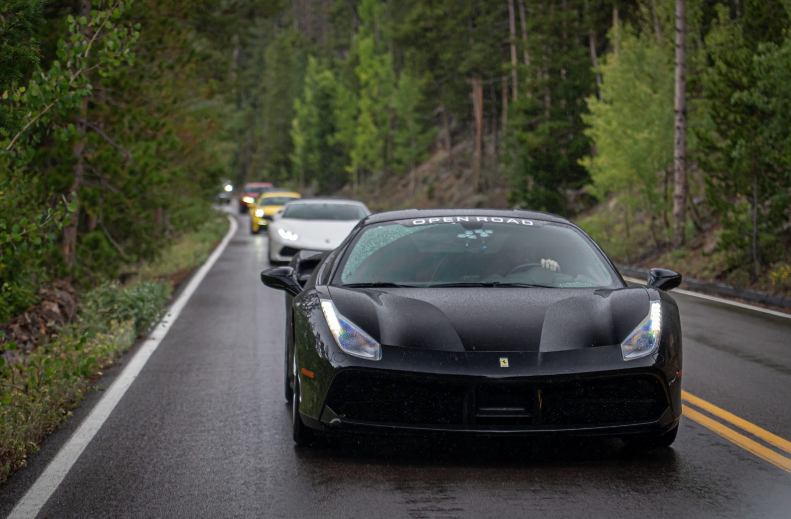 Xtreme Xperiences Open Road Fleet driving through the Rocky Mountains of Colorado.